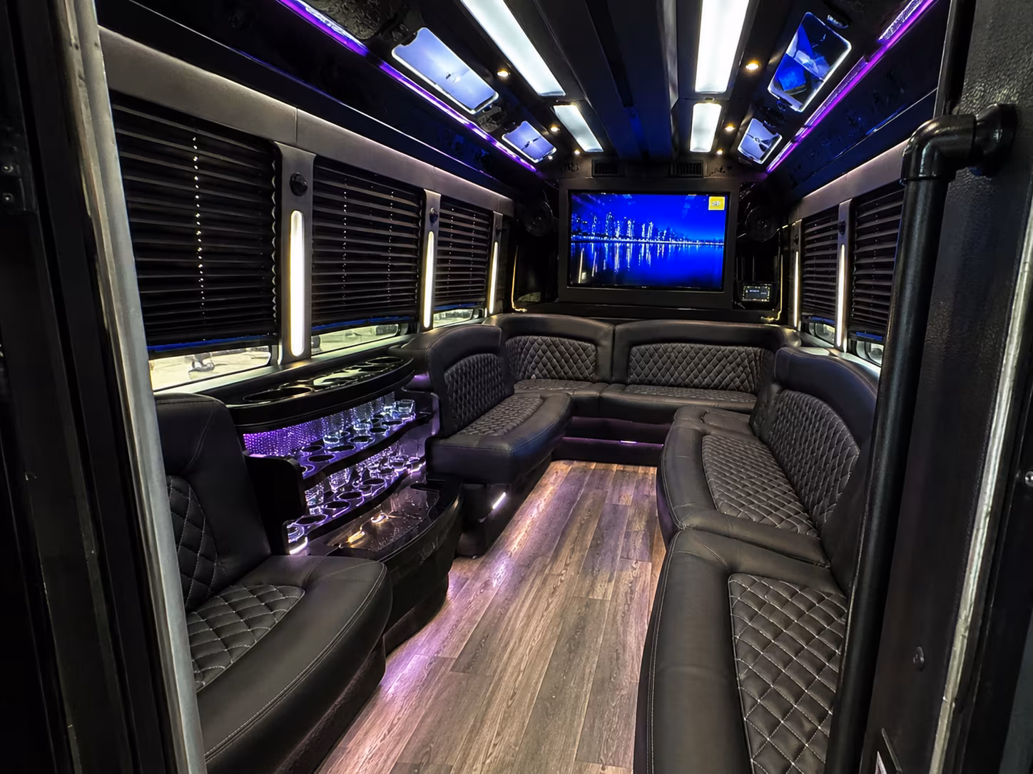 Friends laughing during a party bus celebration in Knoxville